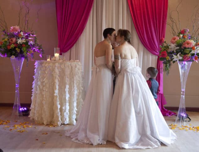Brides Kissing Photo