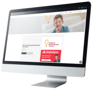 The homepage of a golf tournament website is displayed on a computer monitor.